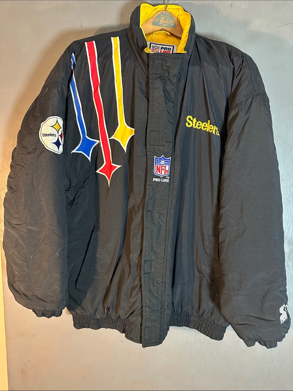 NFL Steelers Black Puffer Jacket with Yellow, Red & Blue Accents